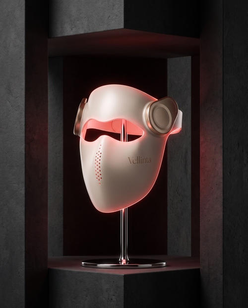 Vellinta Lumina Pro with red light therapy active, shown in a dark graphite alcove